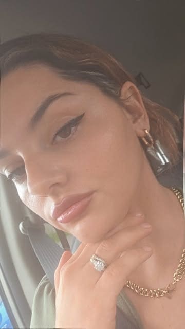 Aura Aesthetics client with clear, glowing skin